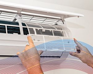 A technician repairing a mini-split A/C