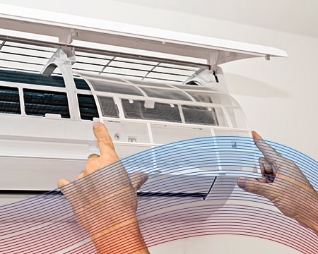 A technician repairing a mini-split A/C